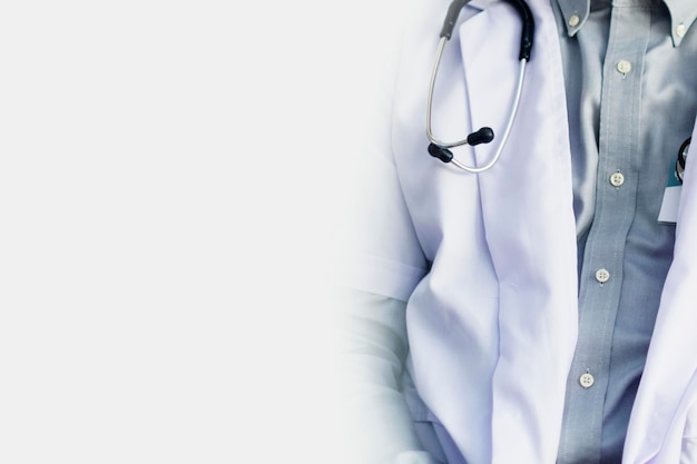 Free photo stethoscope on a doctors gown background