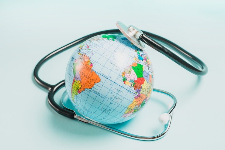 Free Photo stethoscope over the globe on blue background