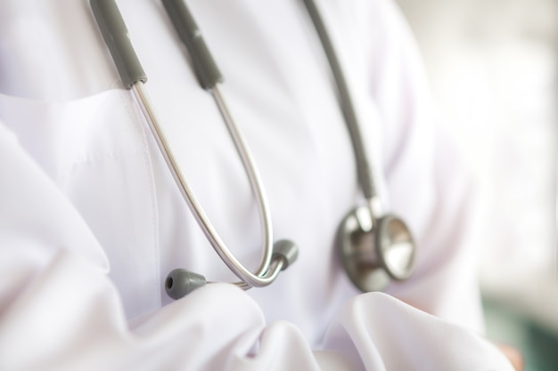 Free photo stethoscope hanging from a doctor's gown