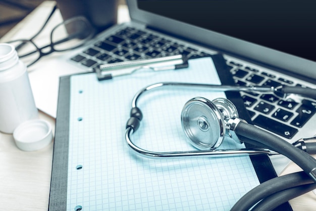 Stethoscope on laptop closeup