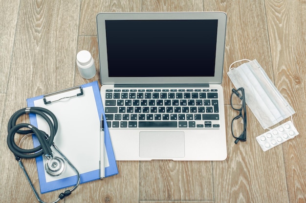 Stethoscope on laptop closeup