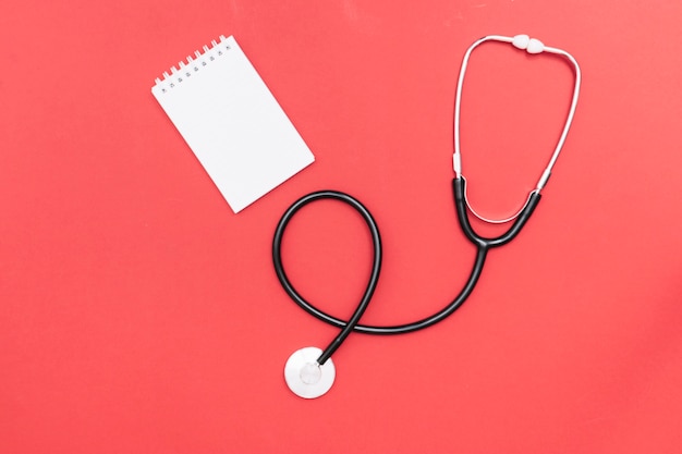 Stethoscope near notebook