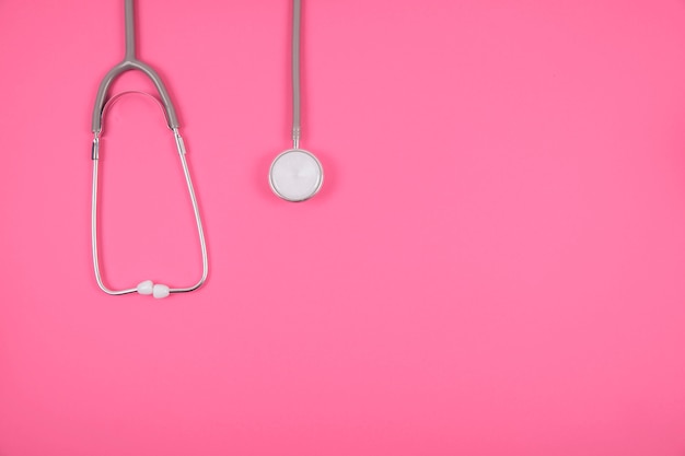 Stethoscope on pink background