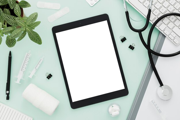 Stethoscope and tablet on desk