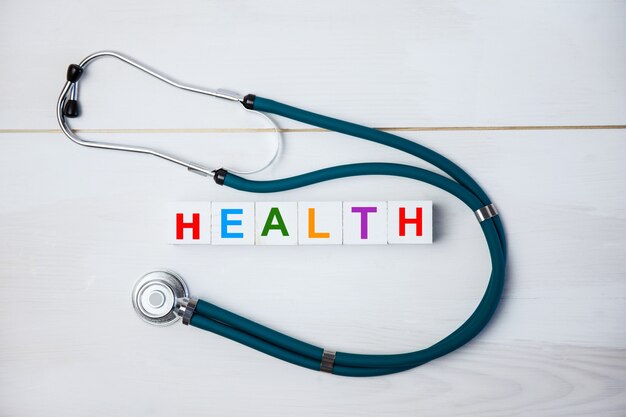 Stethoscope and the word "health"