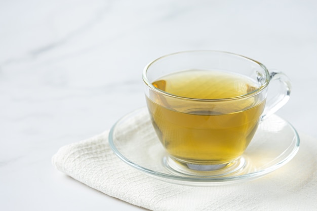 Stevia tea in a glass cup on the table