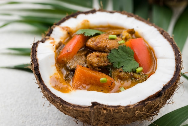 Stew in coconut plate close-up