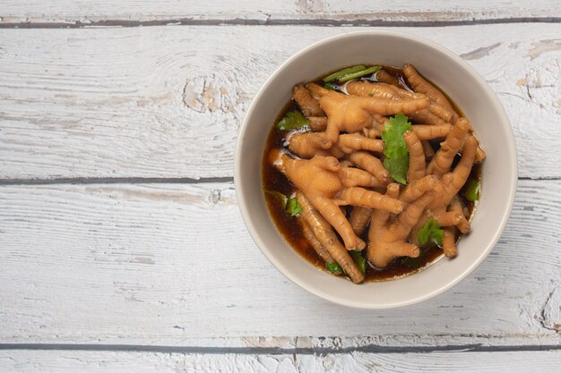 Stewed Chicken Feet soup served with spicy fish sauce