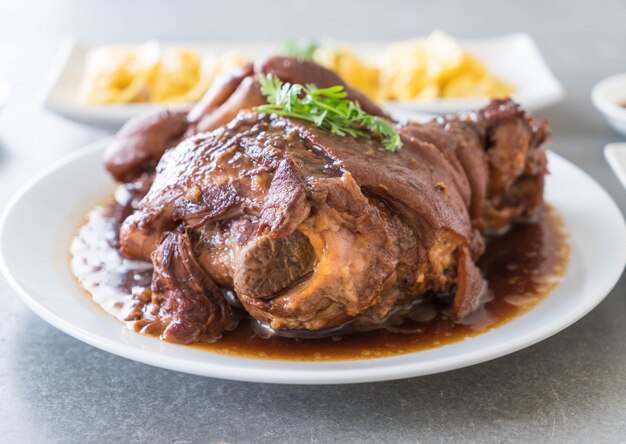 Stewed pork leg in gravy soup