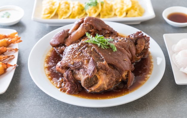 Stewed pork leg in gravy soup