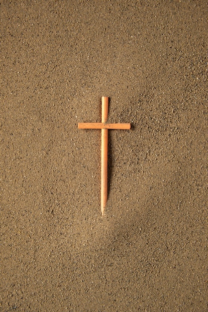 Free photo stick cross on the sand