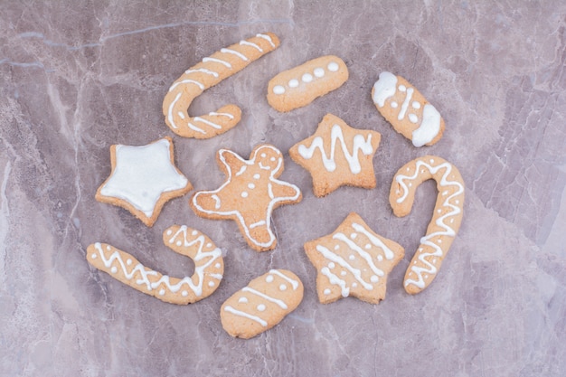 Stick, star and ovale shape gingerbread cookies on the marble