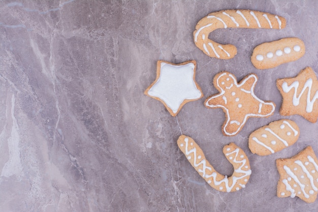 Stick, star and ovale shape gingerbread cookies on the marble