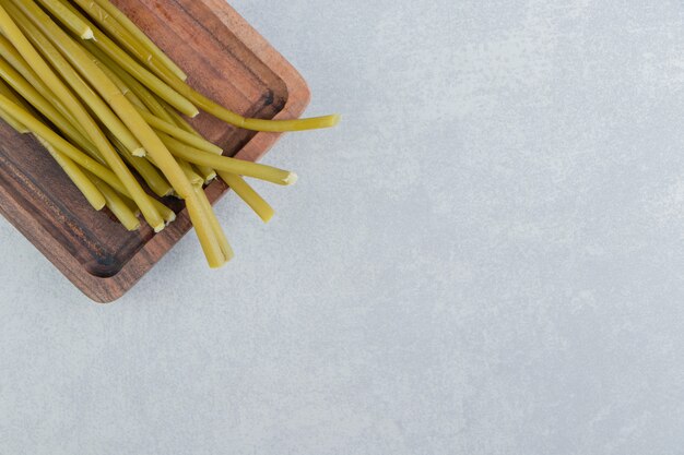 Sticks on a cutting board, on the marble surface