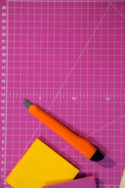 Sticky notes and cutter on graph