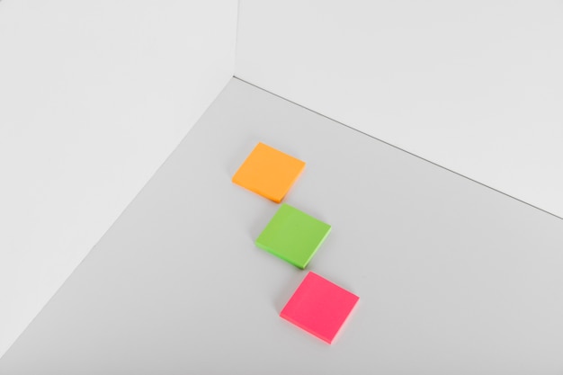 Sticky notes in different colors in corner of room