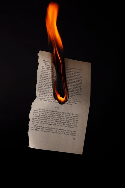 Still life of burnt paper with flames