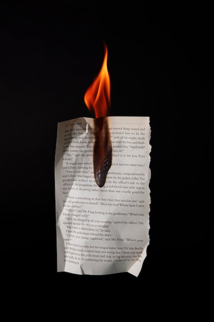 Free photo still life of burnt paper with flames