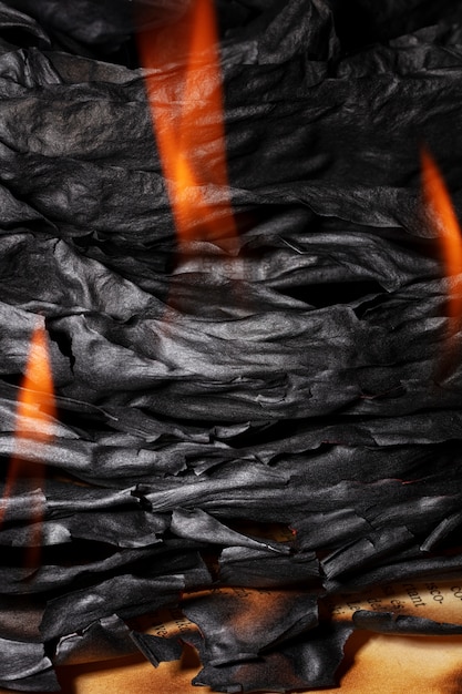 Free photo still life of burnt paper with flames