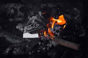 Free photo still life of burnt paper with flames