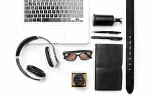 Free photo still life of casual man. modern male accessories and laptop on white