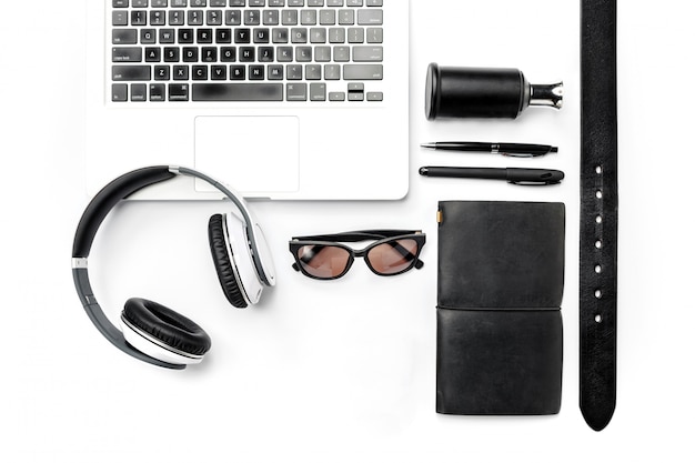 Free photo still life of casual man. modern male accessories and laptop on white