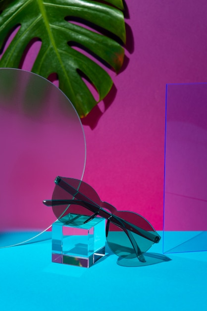 Free photo still life of colored transparent sunglasses