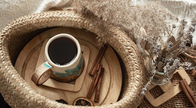 Still life in a cozy room with a beautiful handmade ceramic Cup .