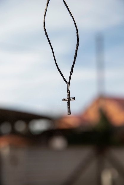 Still life of crucifix on a thread