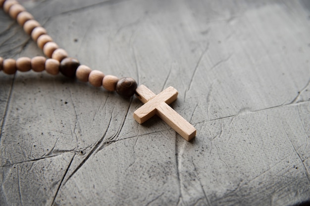 Still life of crucifix with beads