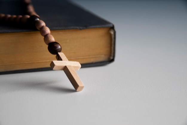 Still life of crucifix with book