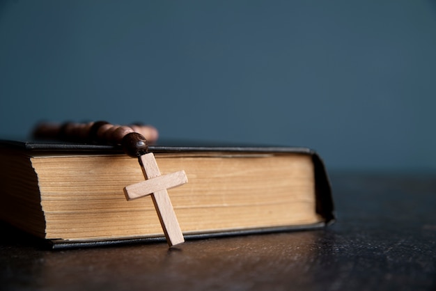 Still life of crucifix with book