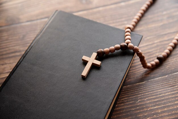 Still life of crucifix with book