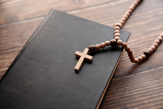 Still life of crucifix with book