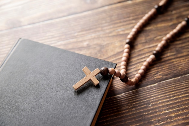 Still life of crucifix with book