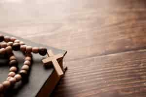 Free photo still life of crucifix with book