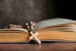 Free photo still life of crucifix with book