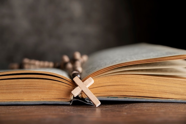 Still life of crucifix with book