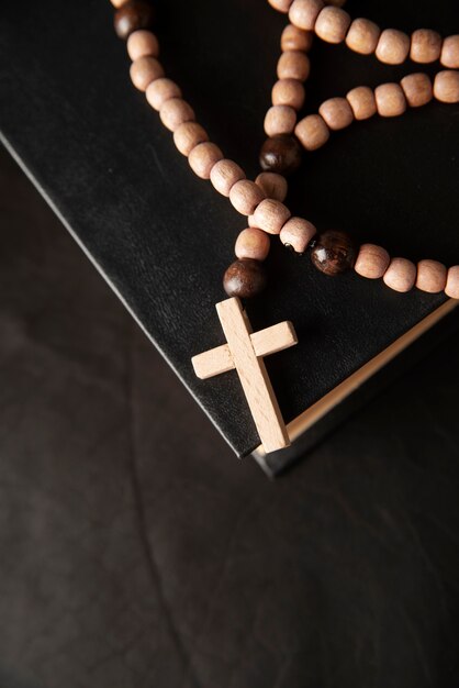 Still life of crucifix with book