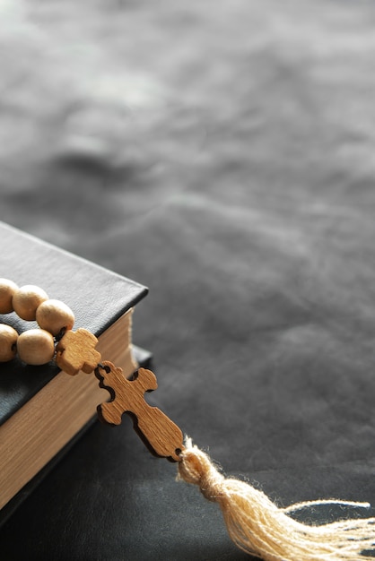 Still life of crucifix with book