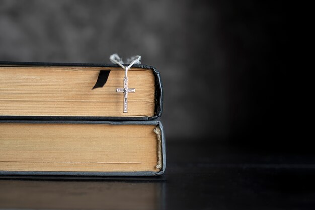 Still life of crucifix with book