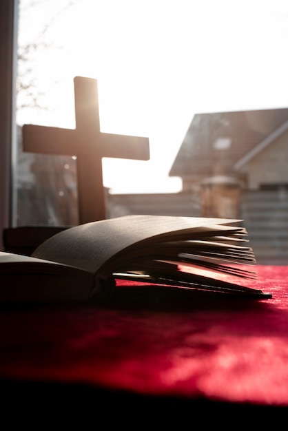 Still life of crucifix with book