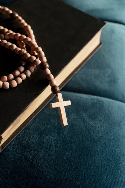 Still life of crucifix with book