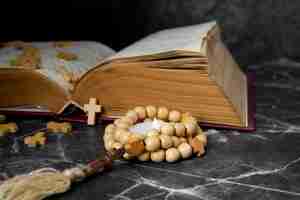 Free photo still life of crucifix with book