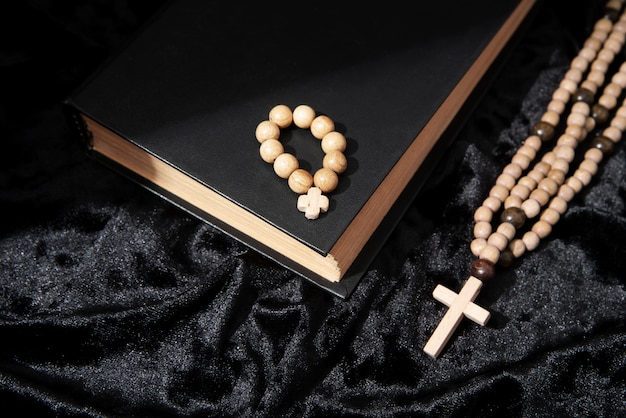 Still life of crucifix with book