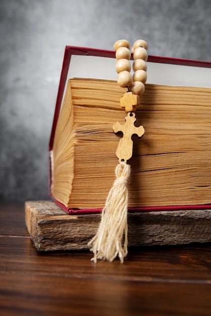 Still life of crucifix with book