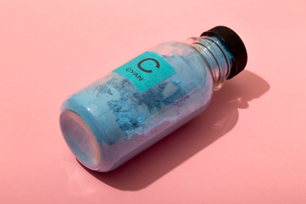 Free photo still life cyan toner arrangement isolated