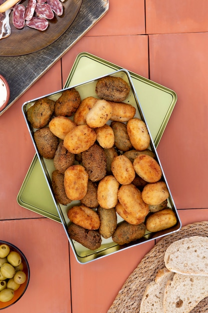 Free photo still life delicious fried croquette composition