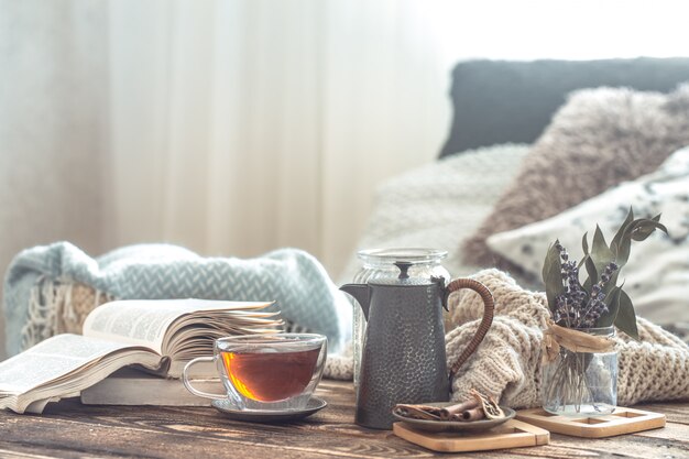 Still life details of home interior on a wooden table with a Cup of tea