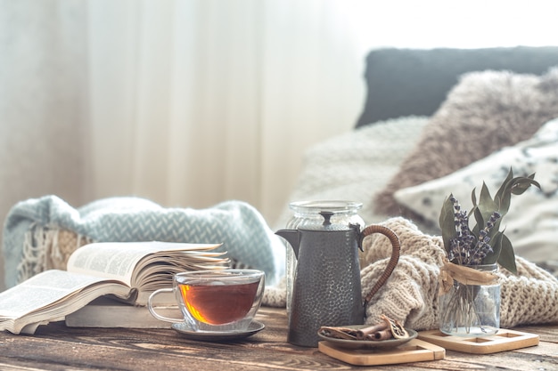 Still life details of home interior on a wooden table with a Cup of tea